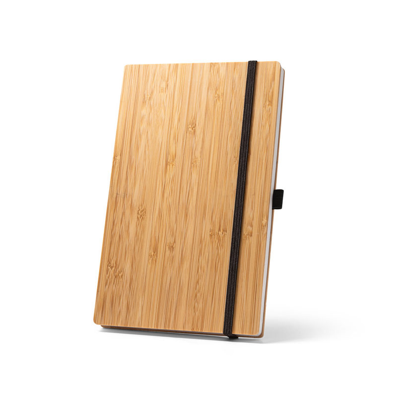 Caderno de bolso com capa e contracapa em placa de bambu e lombada em poliéster 100% reciclado, com páginas lisas recicladas